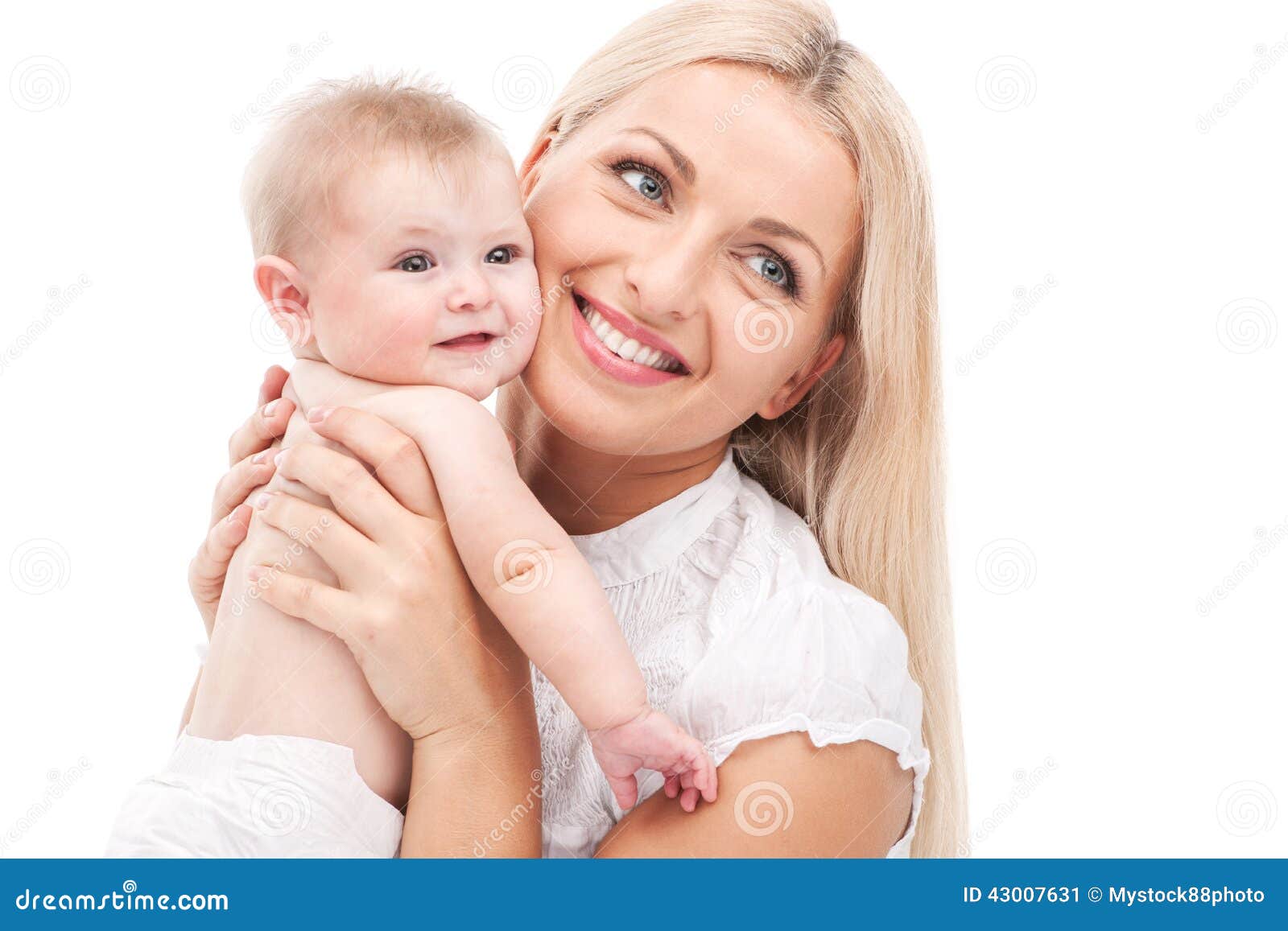young mum hugging small baby. beautiful blond holding baby and smiling