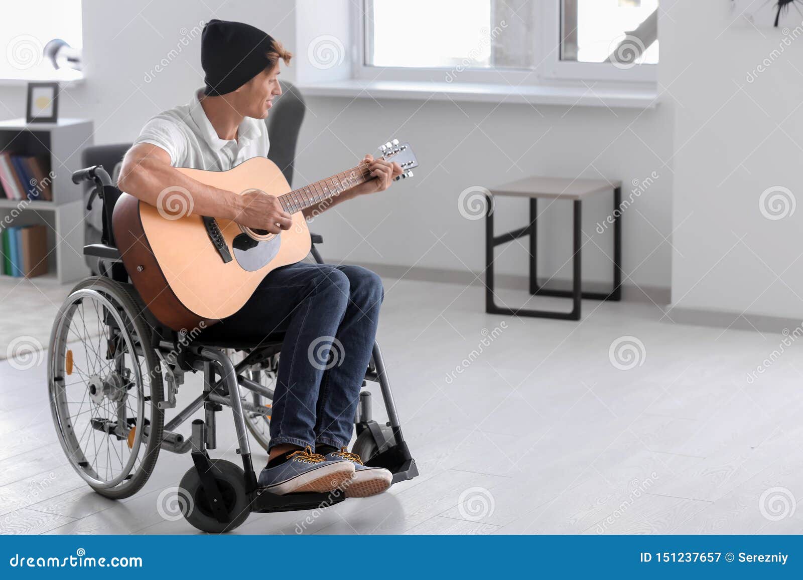 Young Musician in Wheelchair Playing Guitar at Home Stock Image Image