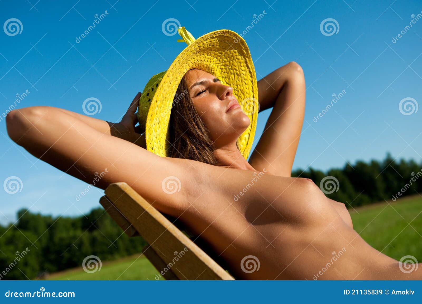 Naked women sunbathing