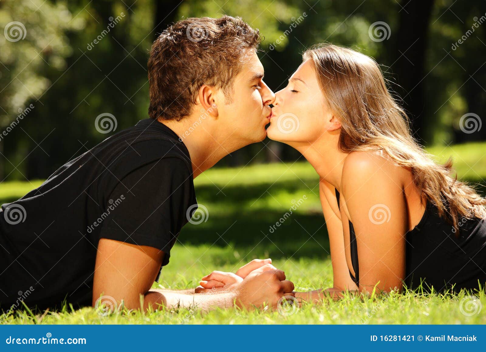 Young Nice Couple Kissing in the Park Stock Image - Image of ...