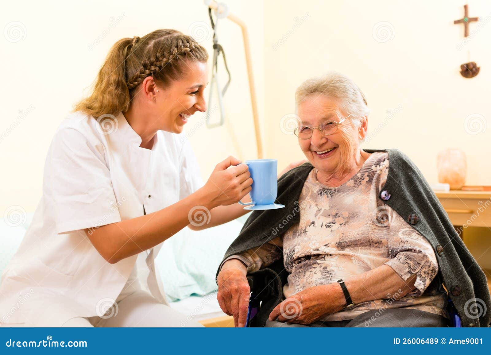 young nurse and female senior in nursing home