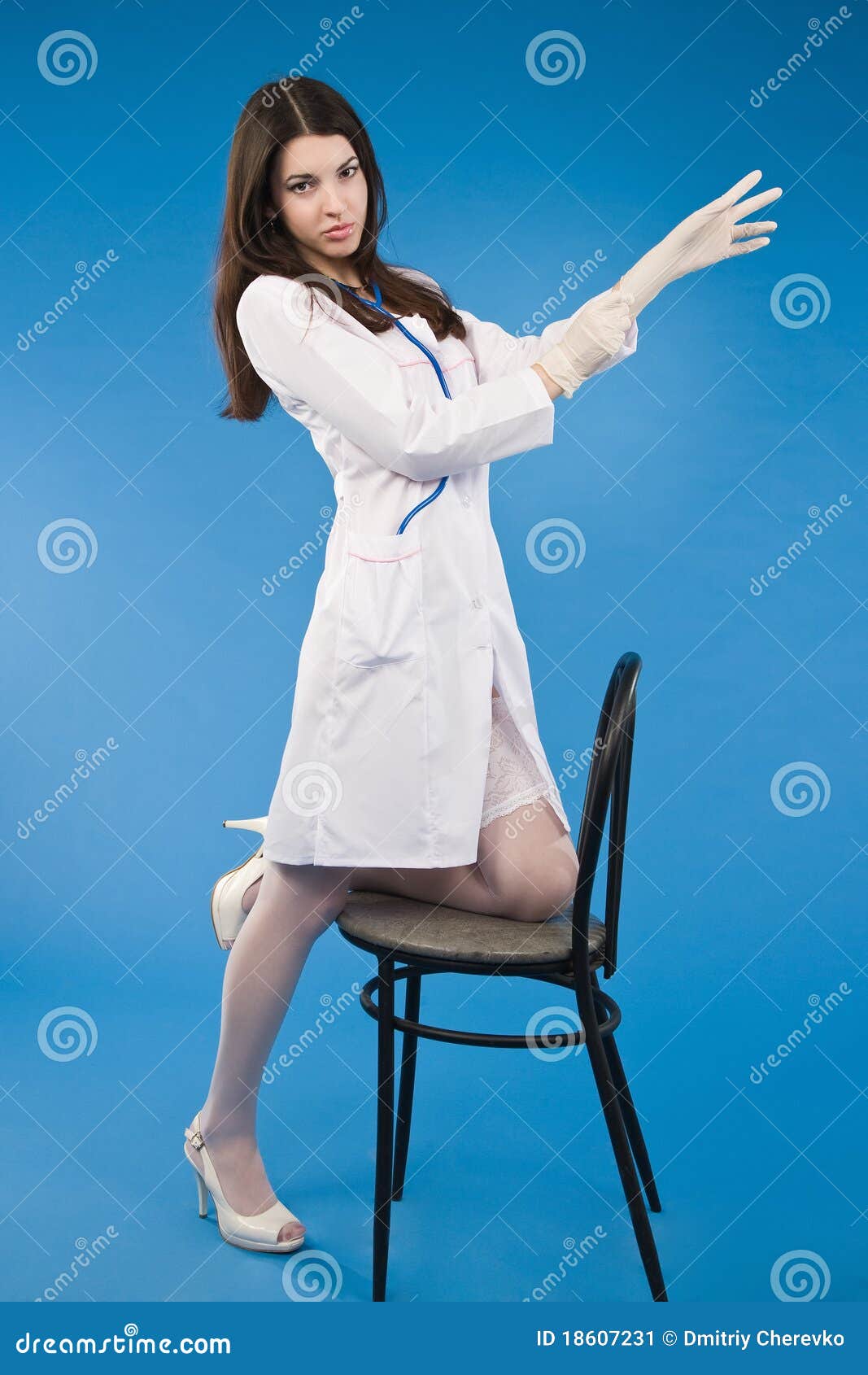 A Young Nurse Pulls Medical Gl