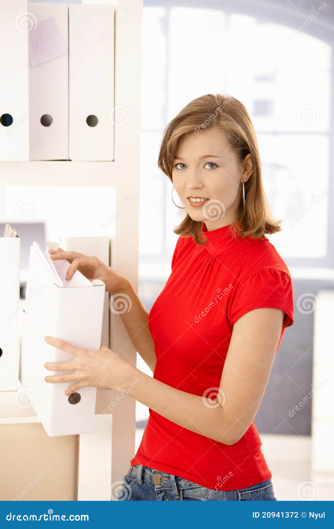 young office worker organizing folders