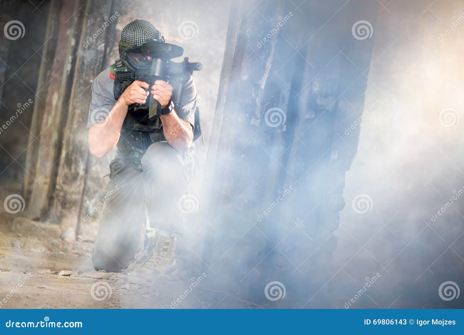 Young paintball in smoke stock image. Image of action 69806143