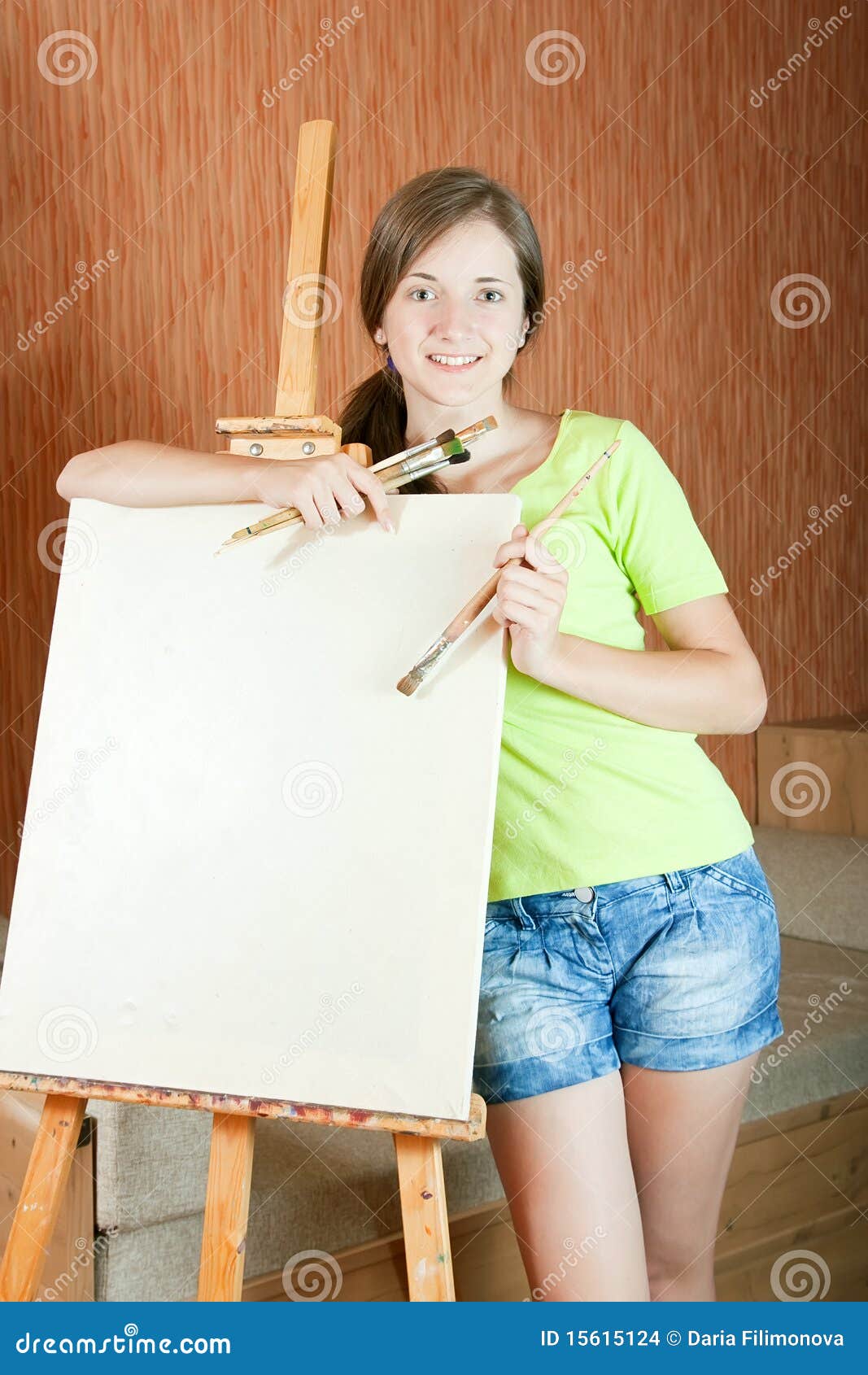 Young painter near easel stock photo. Image of brown 15615124