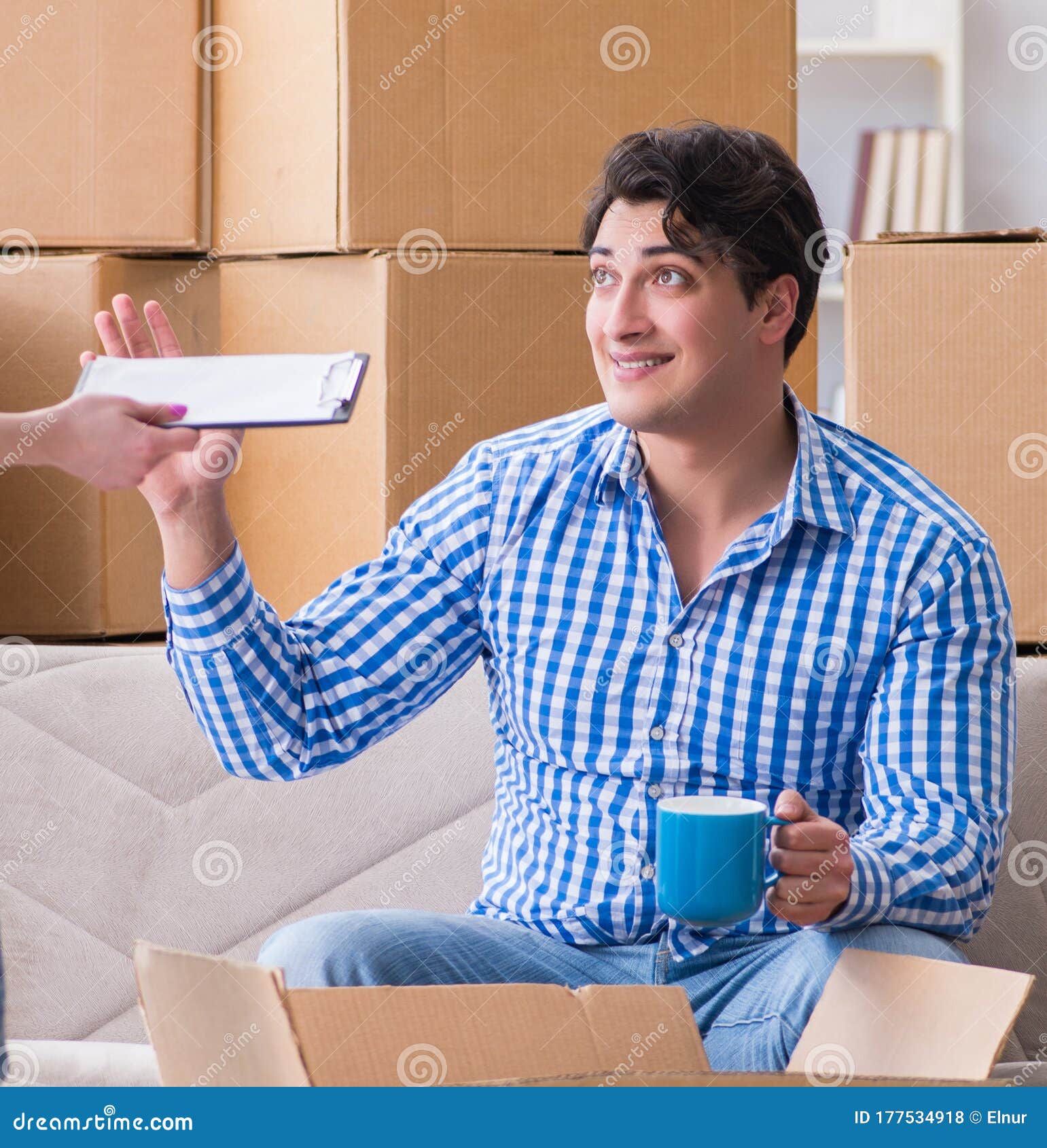 Young Pair Moving in To New House with Boxes Stock Photo Image of