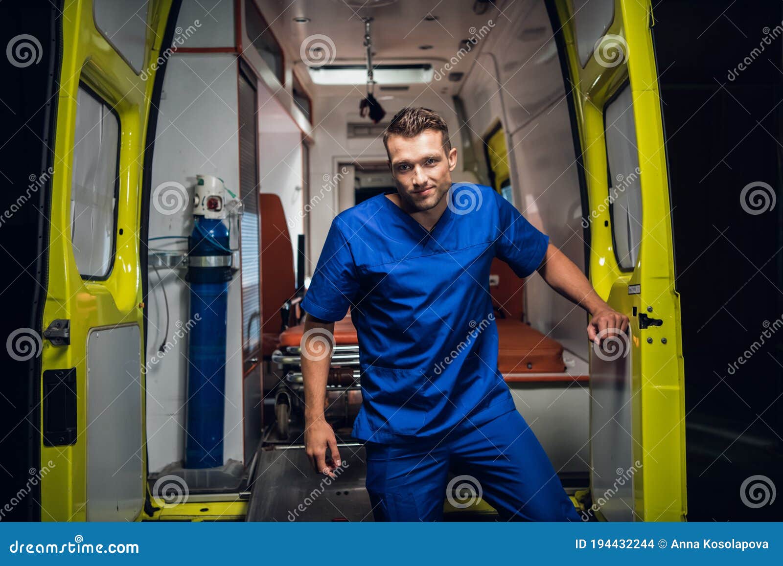 Young Paramedic Giving An Oxygen Mask To His Female Patient In An Ambulance Car Stock Image 