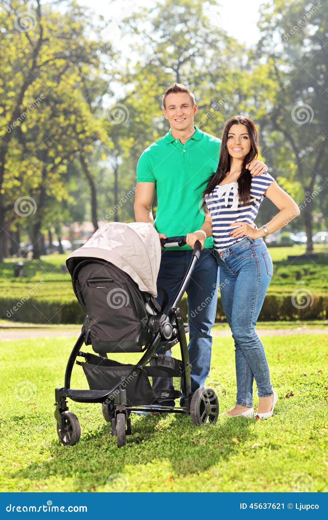 Young Parents Posing With Their Baby In A Park Stock Image Image Of Parent Mother
