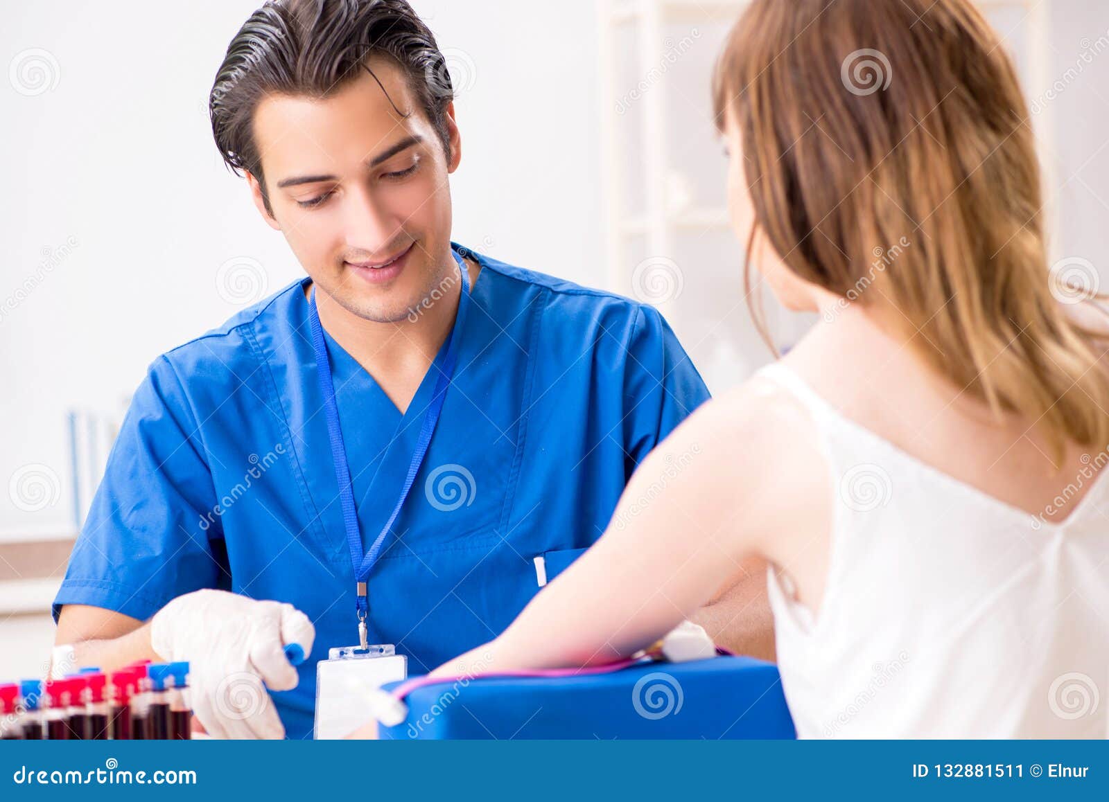 The Young Patient during Blood Test Sampling Procedure Stock Image