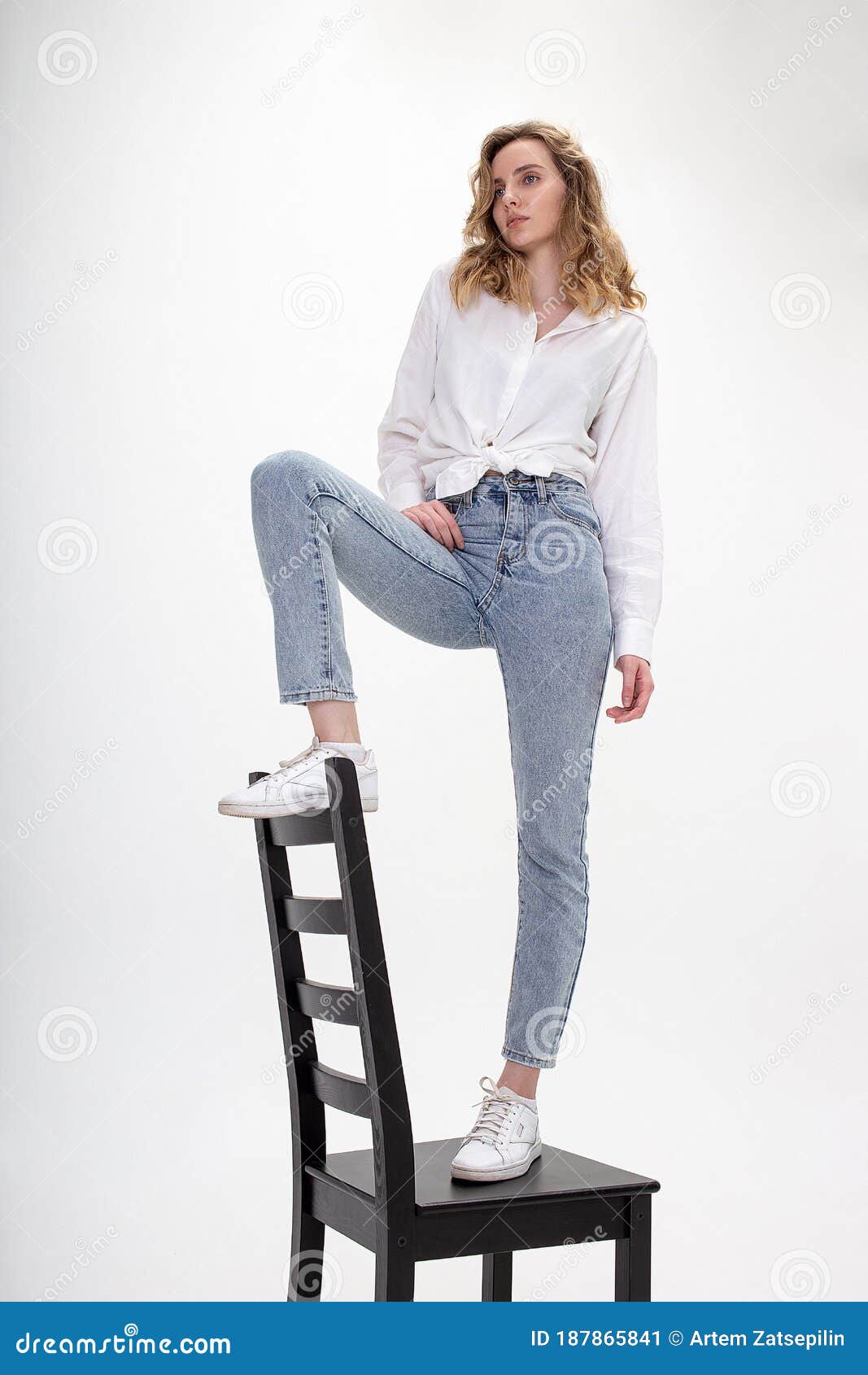 Young Pensive Caucasian Girl Poses In White Shirt Blue Jeans On Chair At Studio Stock Image Image Of Pretty Person Young Pensive Caucasian Girl Poses In White Shirt Blue Jeans On Chair At Studio Stock Image Image Of Pretty Person