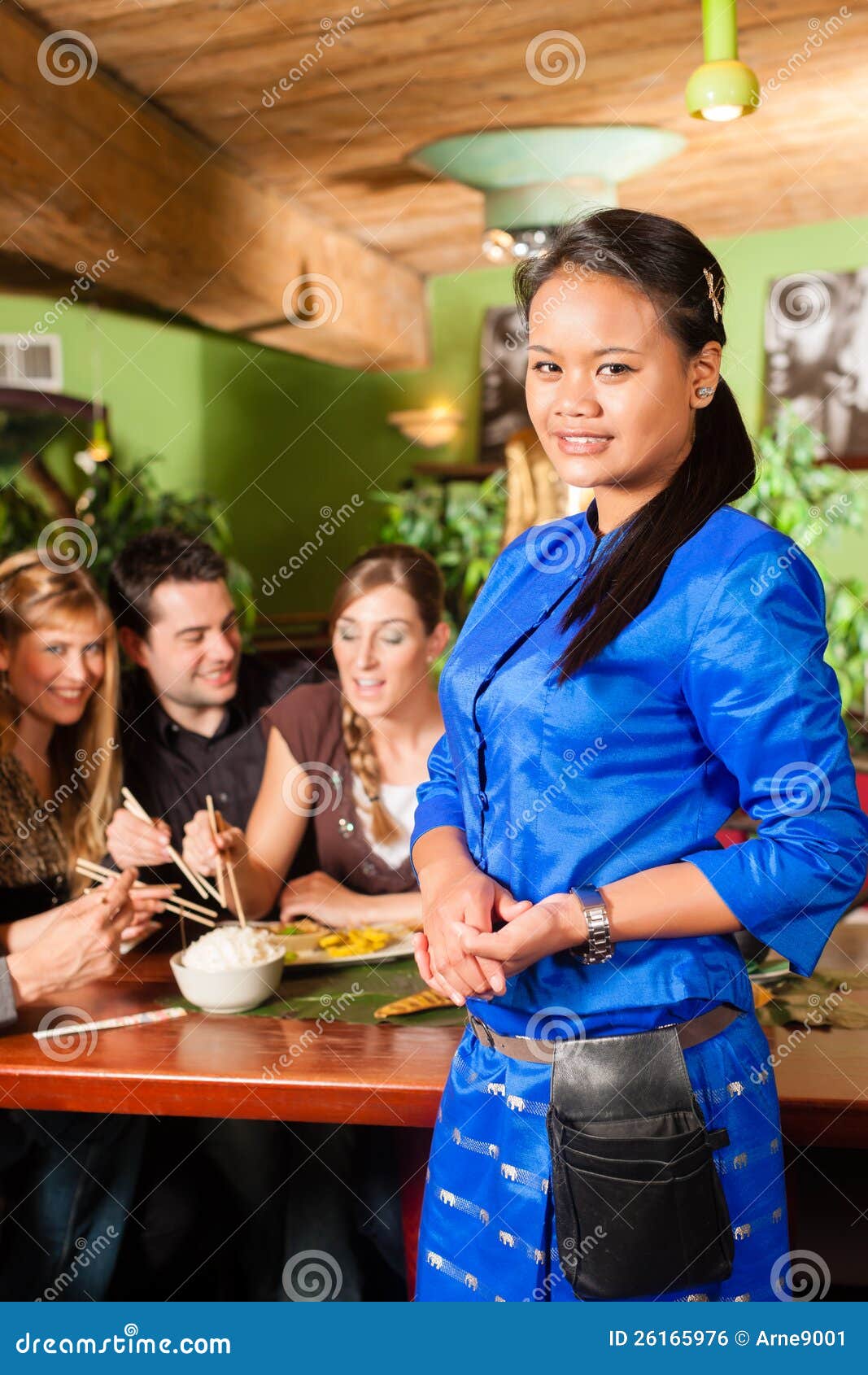 Young People Eating In Thai Restaurant Stock Photo - Image