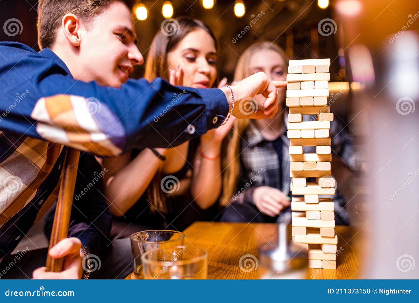 Young People Have Fun Playing Board Games at a Table Stock Photo Image of adult, party 211373150