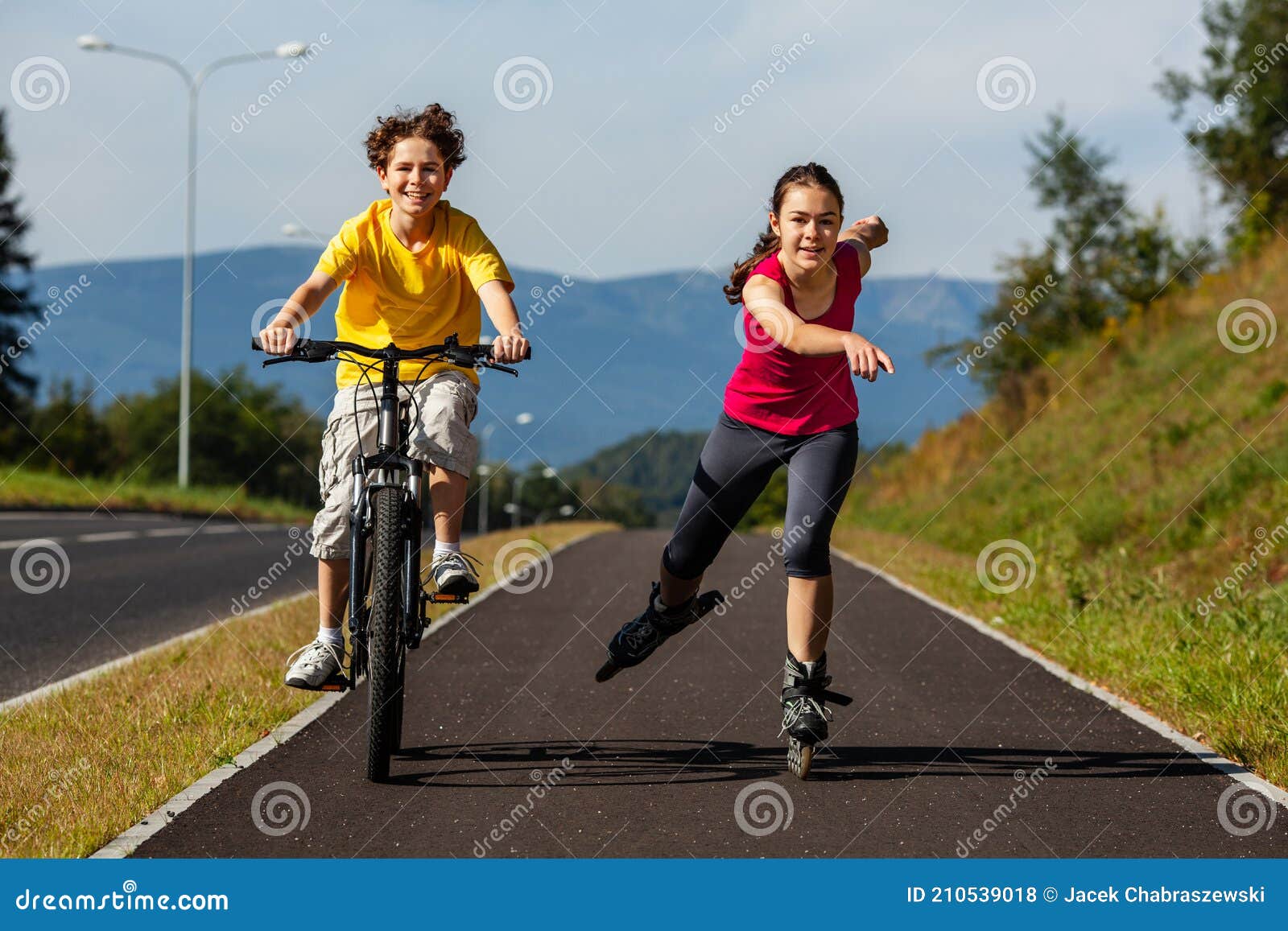 Young People Rollerblading, Cycling Stock Photo Image of active
