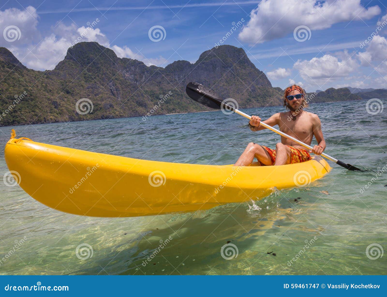 People Rowing In The Distance On A Rowing Canal And A Coffee Table With