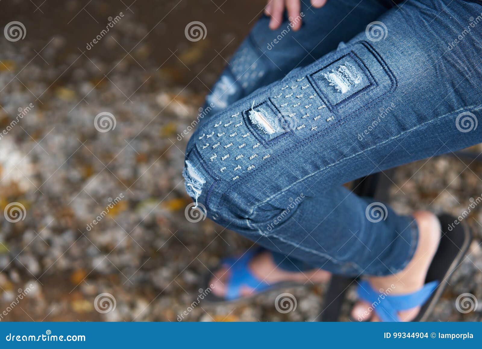 Young People Wearing a Blue Distressed Jeans ,ripped Jeans,torn Stock ...