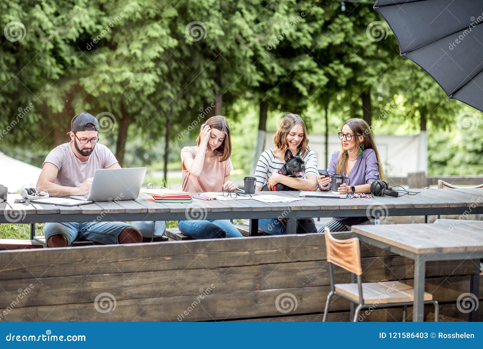 Young People Working at the Outdoor Cafe Stock Image Image of