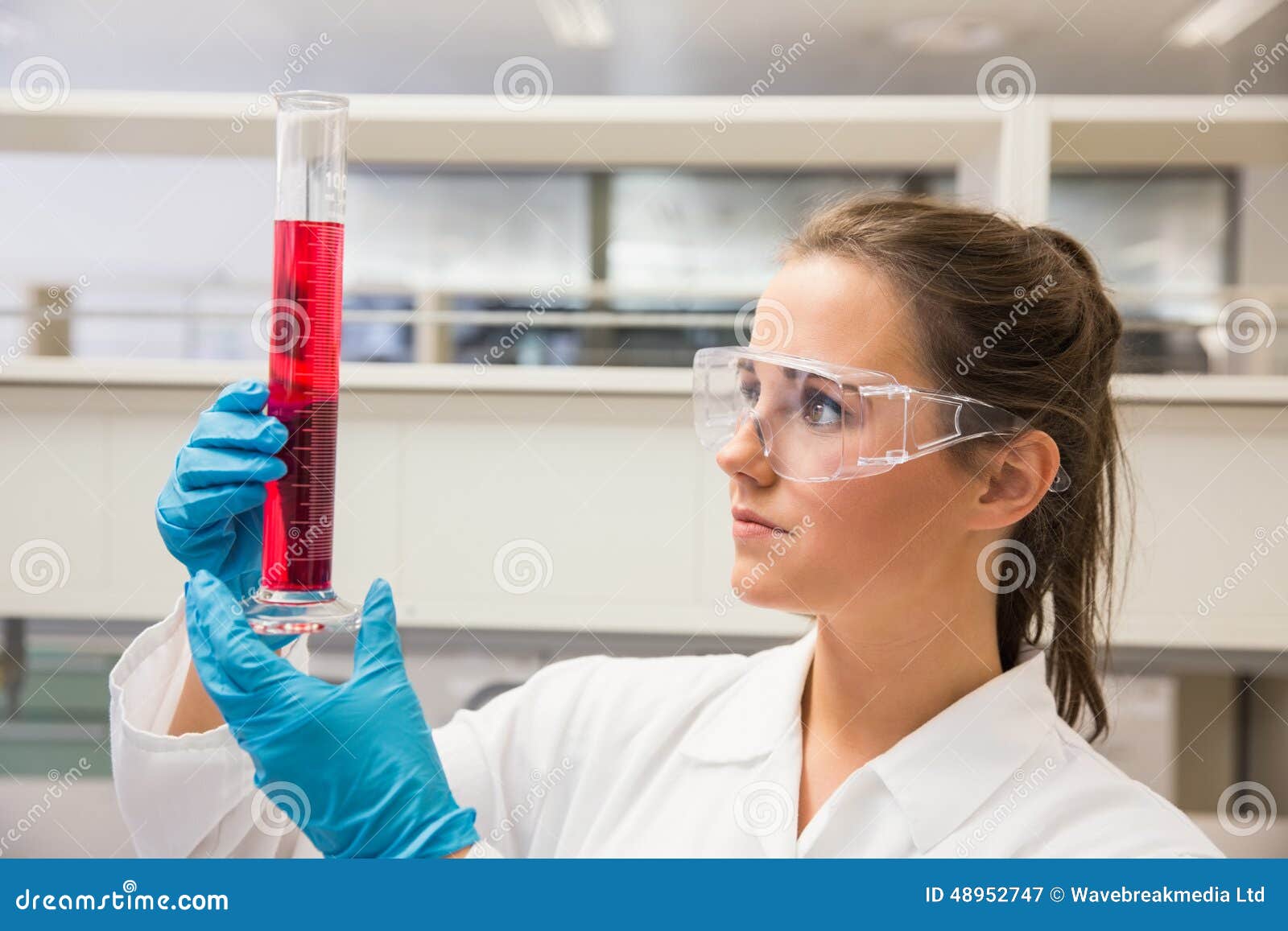 Young Pharmacist Holding Beaker of Red Liquid Stock Image Image of