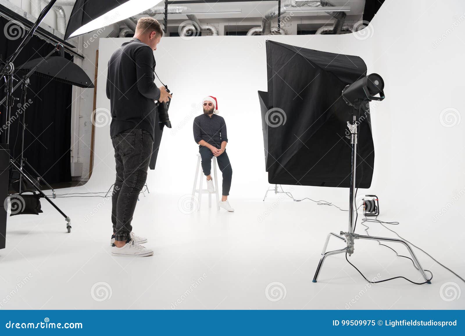 Photographer Working in Studio with Model Stock Image Image of