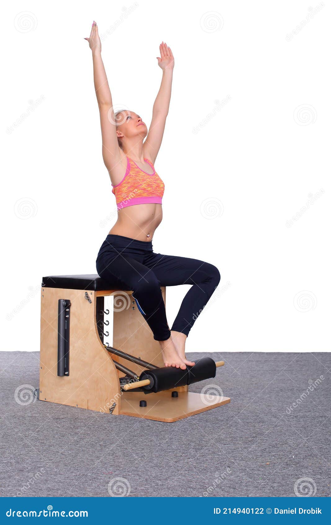 A 20-year-old Trainer Practices Pilates on an Elevator Chair