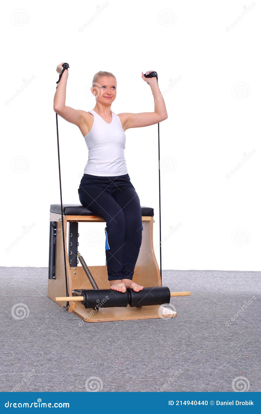 A 20-year-old Trainer Practices Pilates on an Elevator Chair with the ...