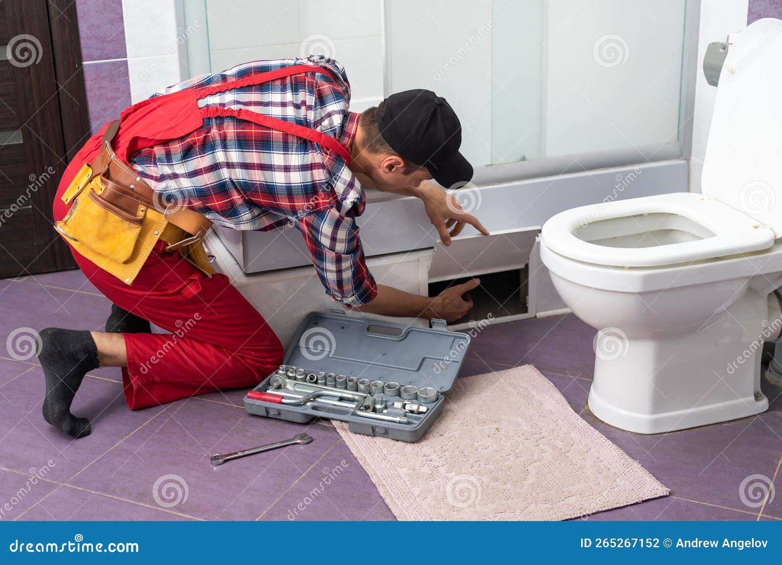Young Plumber Fixing Shower Cabin. Stock Photo Image of occupation