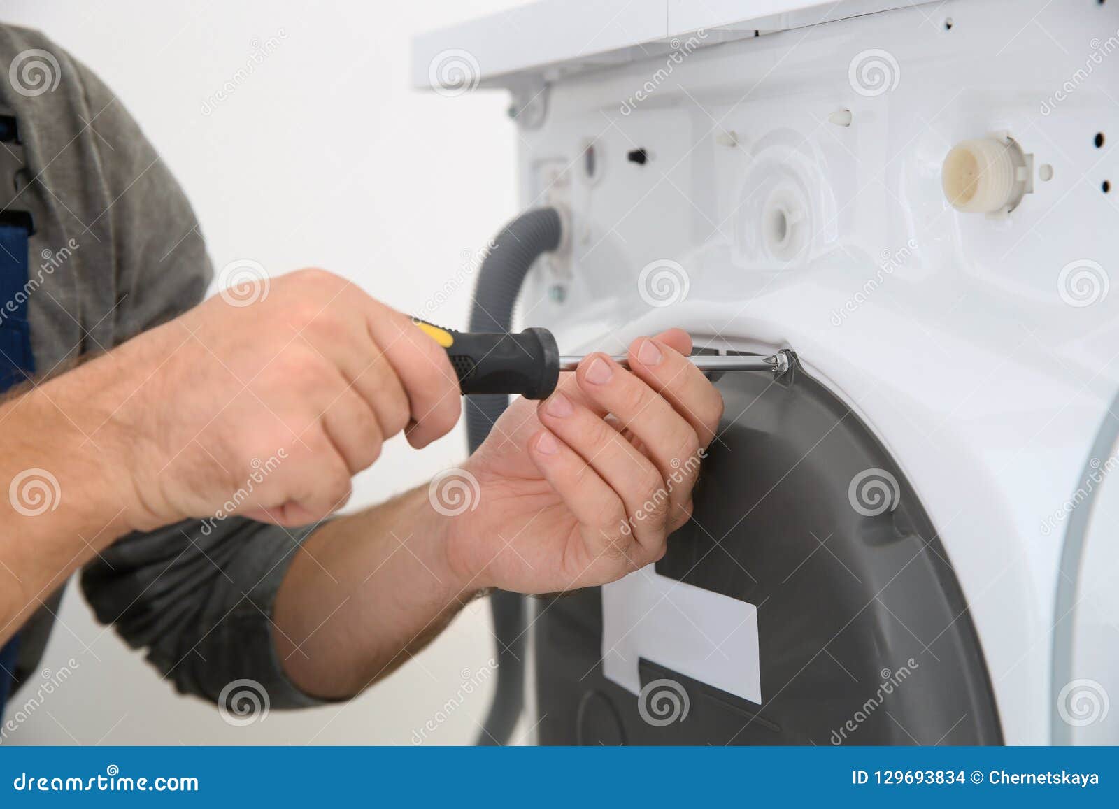 Young Plumber Fixing Washing Machine in Bathroom Stock Photo Image of