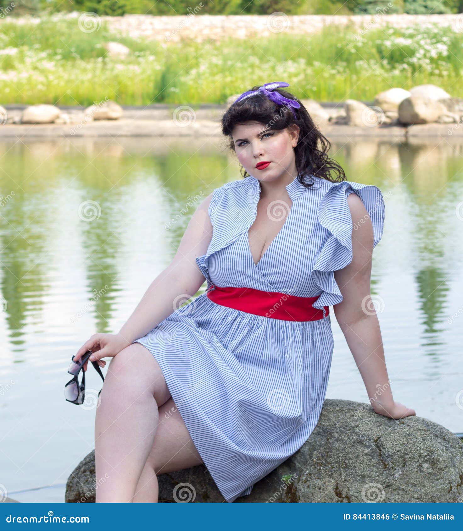 Young Plus Size Model in Dress Sitting on a Rock Stock Photo - Image of  happiness, seductive: 84413846