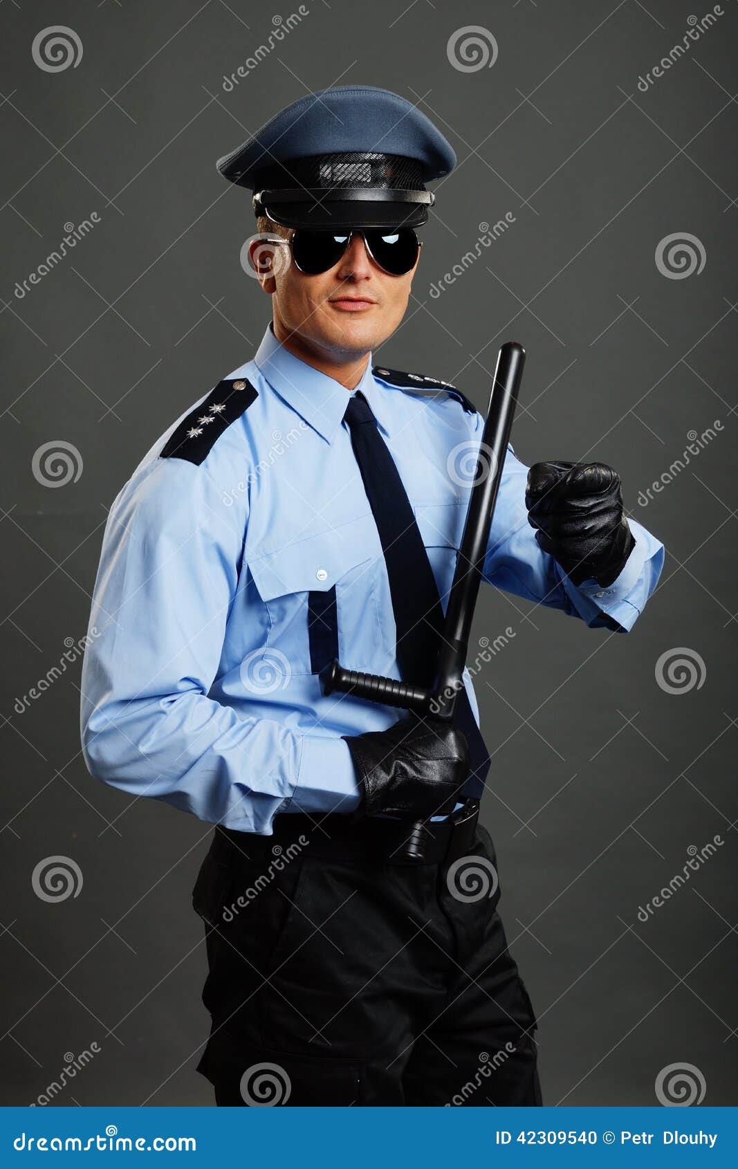 Young policeman in uniform stock photo. Image of gloves 42309540