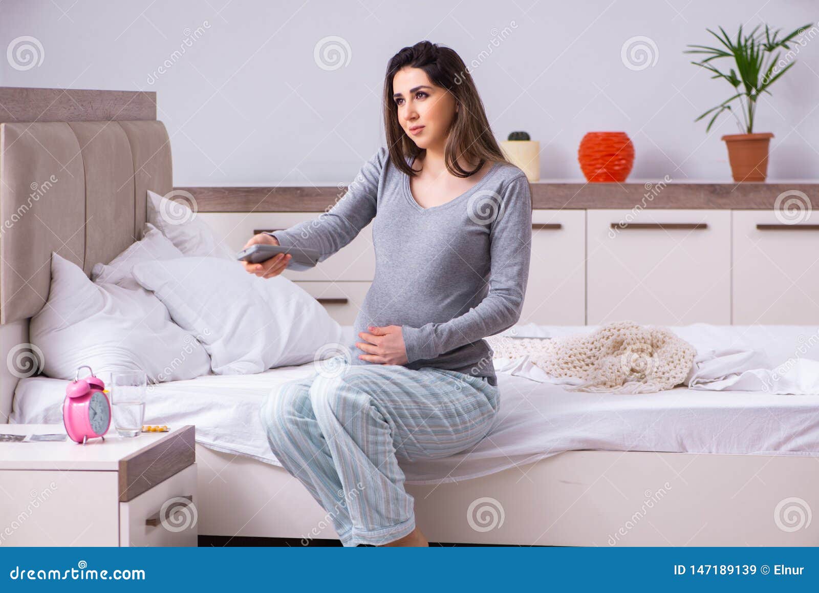 The Young Pregnant Woman In The Bedroom Stock Image Image Of Control Expecting 147189139