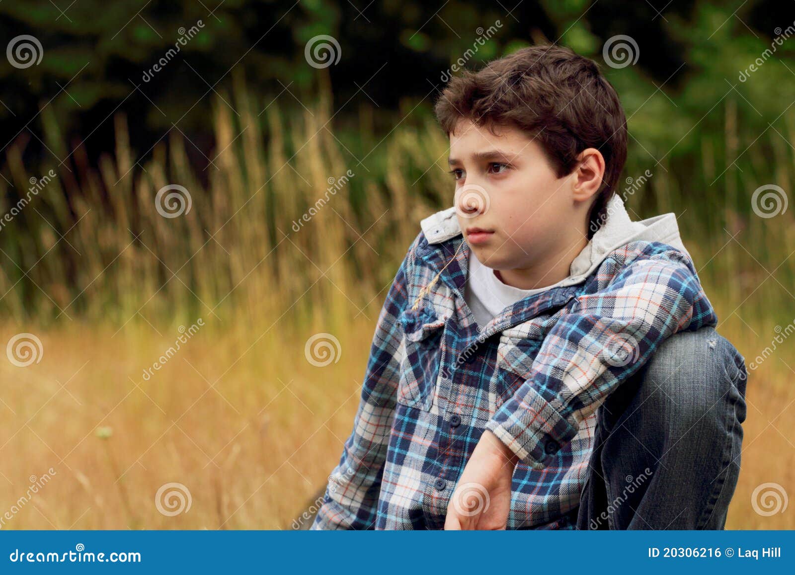 a young preteen boy in field