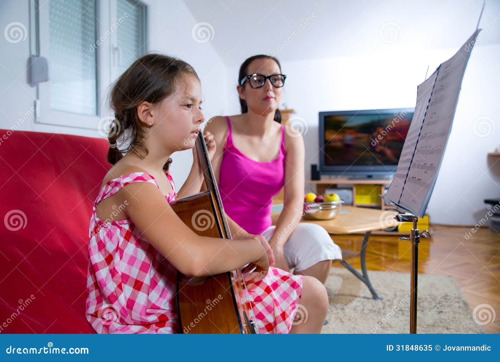 Young Preteen Girl Having Guitar Lesson At Home Stock I