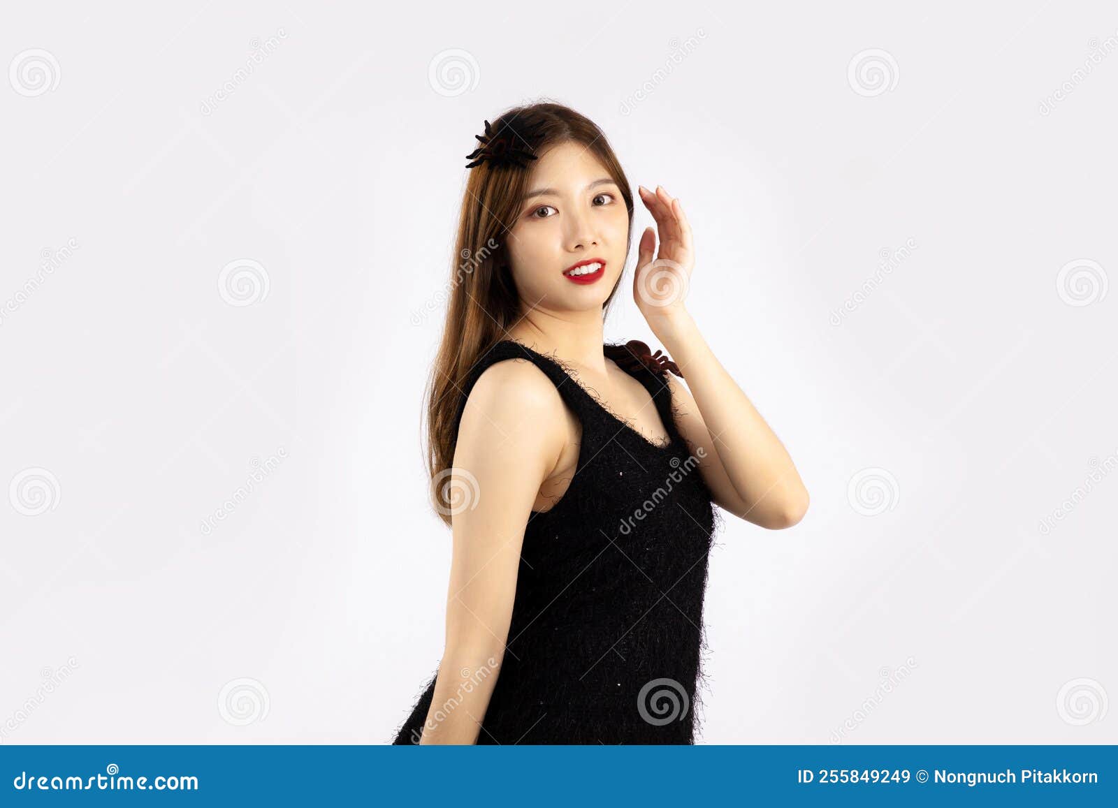 Young Pretty Asian Woman Long Hair Style in Black Dress Posing on White