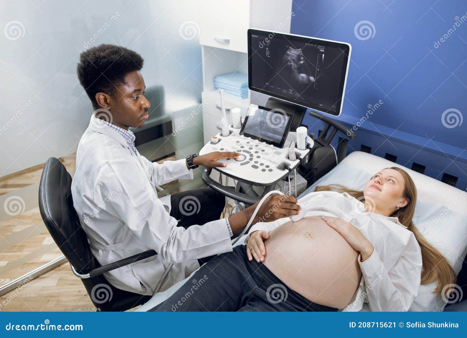 Young Pretty Pregnant Woman Ultrasound Scan from Doctor. Professional Confident African Man Doctor Obstetrician Stock Image - Image of medical, african: 208715621