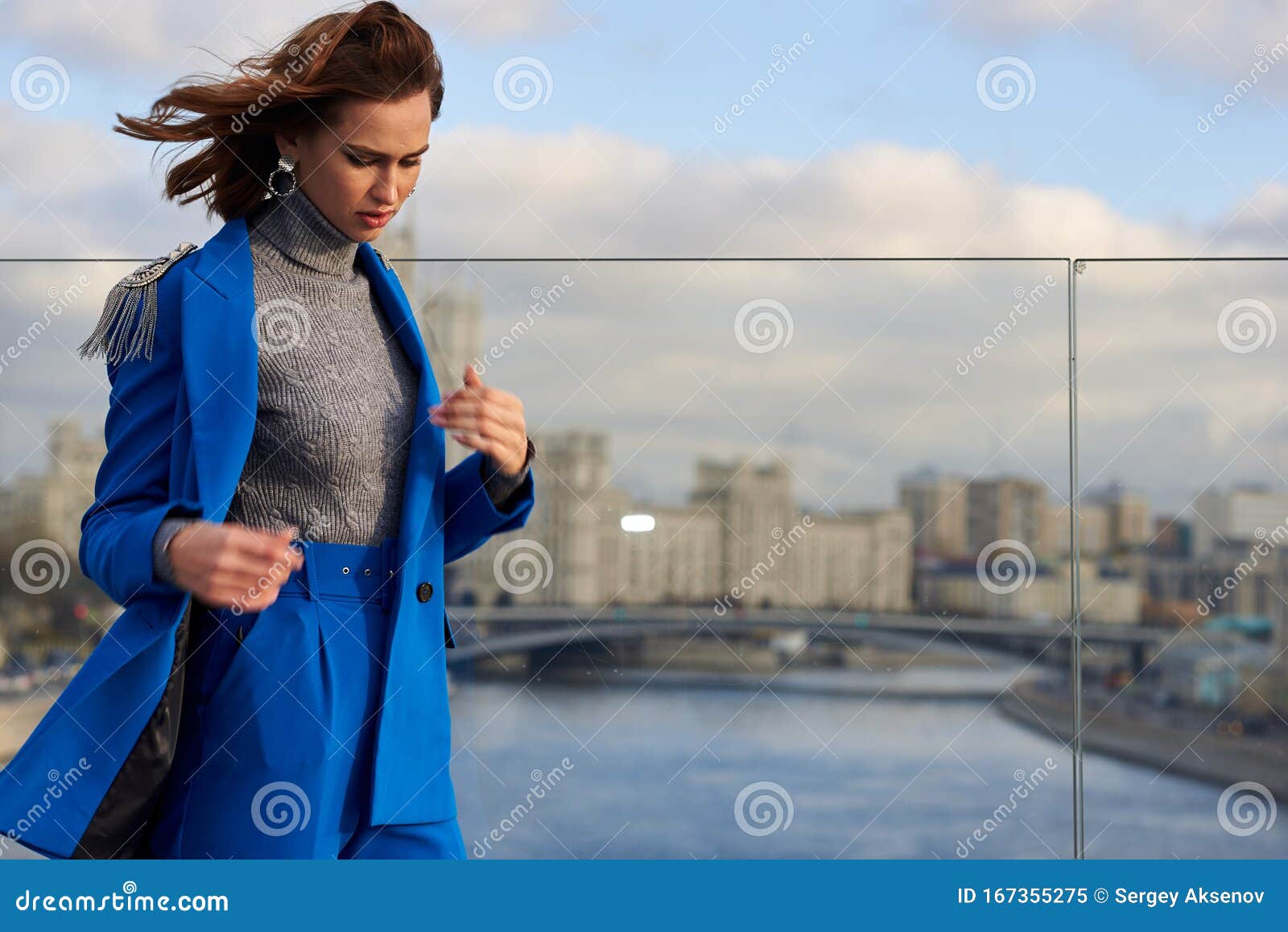 Young Pretty Woman in a Blue Suit Walking and Posing Outdoors Stock ...