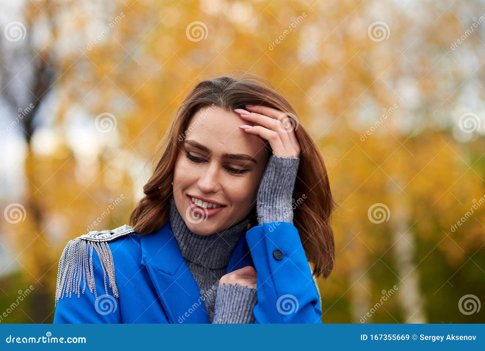 Young Pretty Woman in a Blue Suit Walking and Posing Outdoors Stock ...