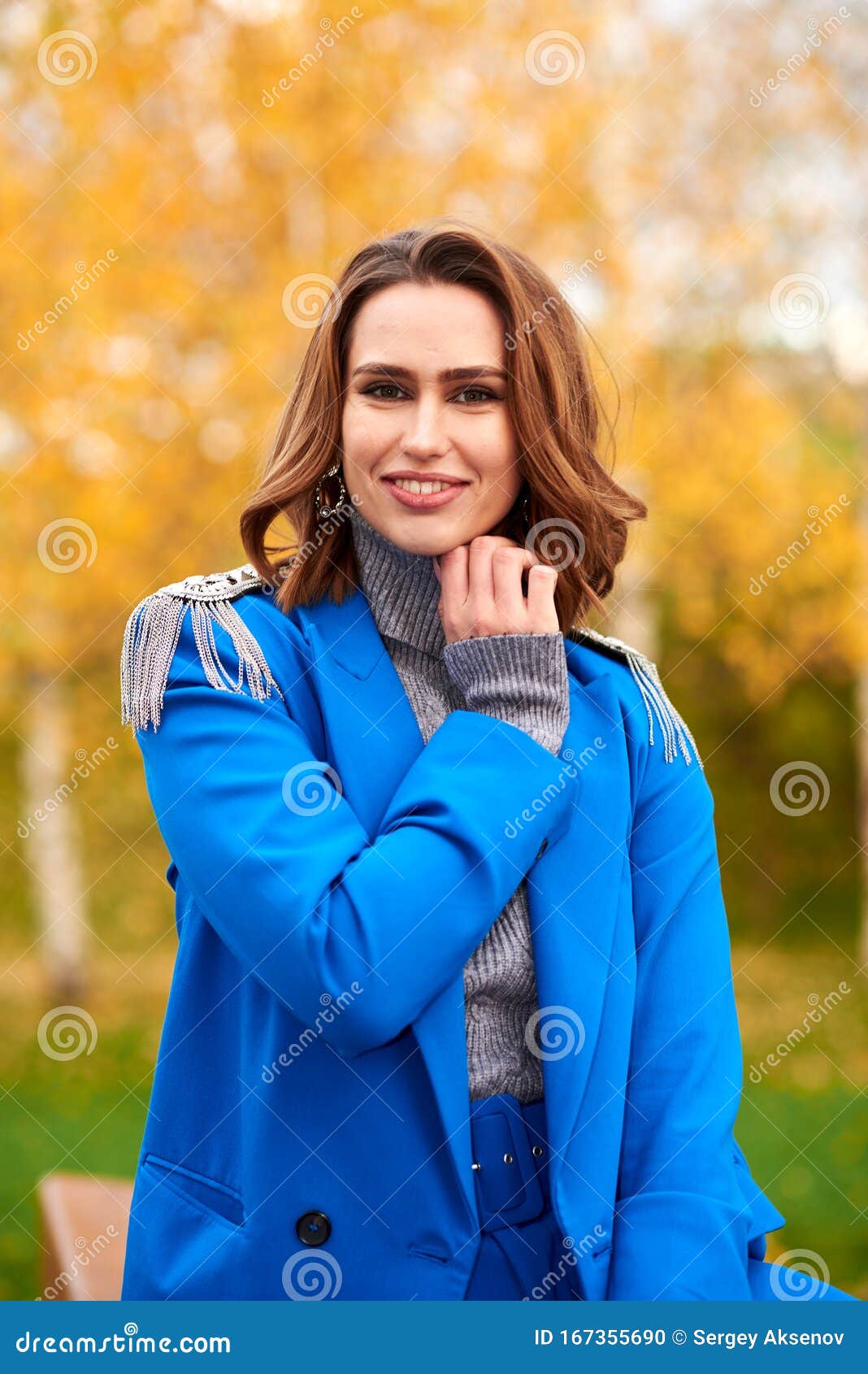 Young Pretty Woman in a Blue Suit Walking and Posing Outdoors Stock ...