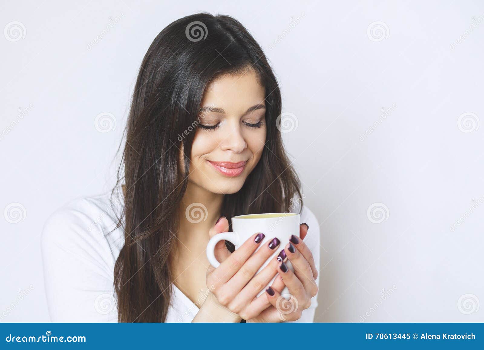 Young Pretty Woman Drinking Coffee or Tea . Relaxing Girl . Woman