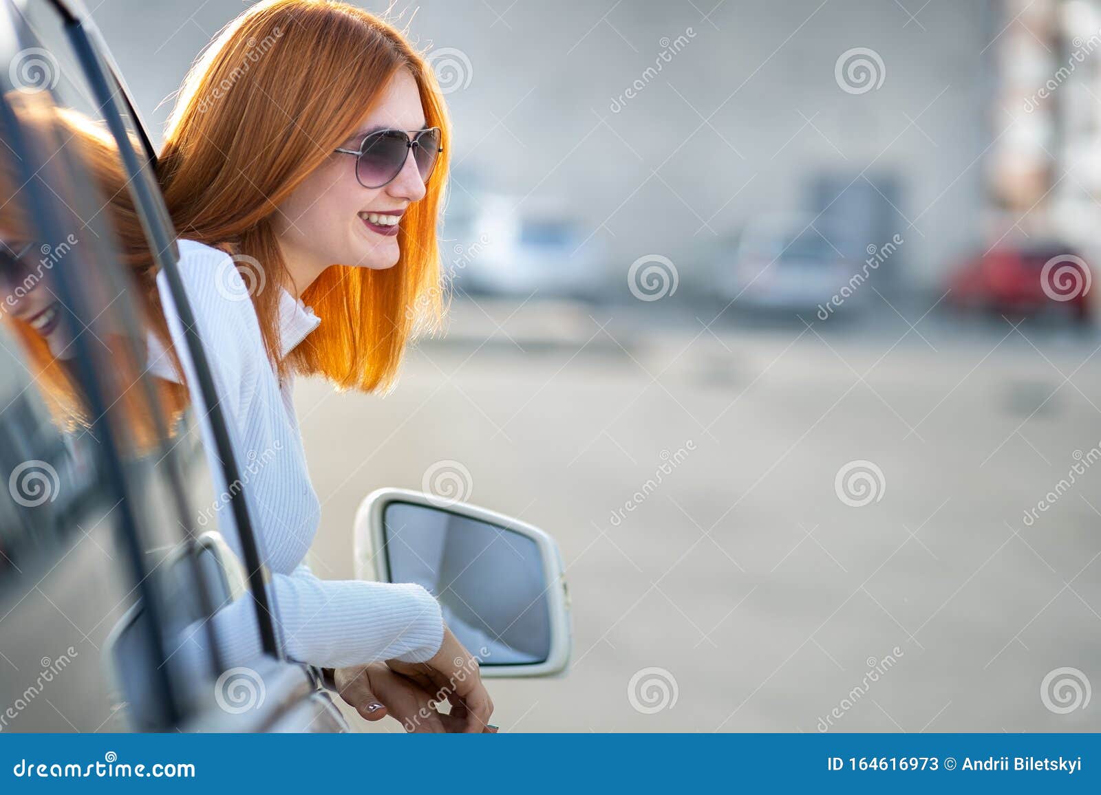 Young Pretty Woman Driver in Sunglasses Looking Out the Car Front ...