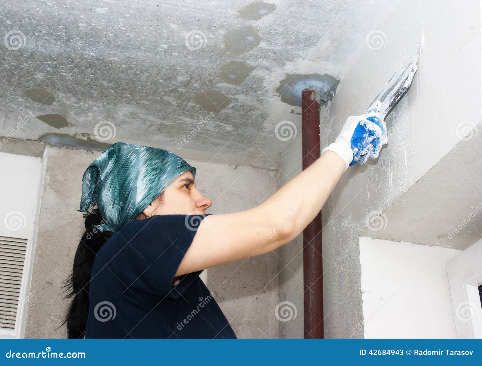 Young Pretty Woman Gets Plaster Wall Stock Image - Image of house