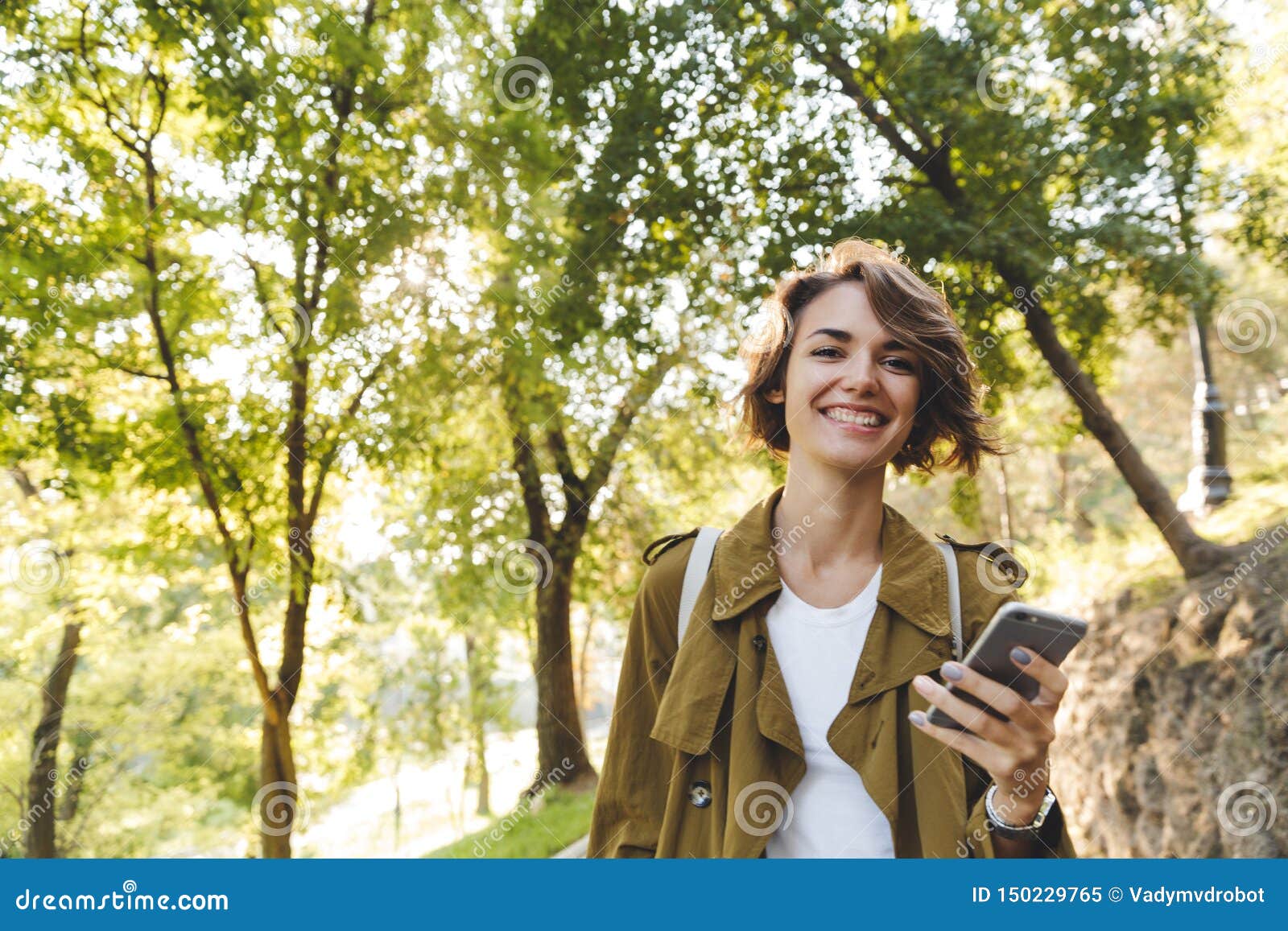 Young Pretty Woman Walking Outdoors in Park in Beautiful Spring Day ...