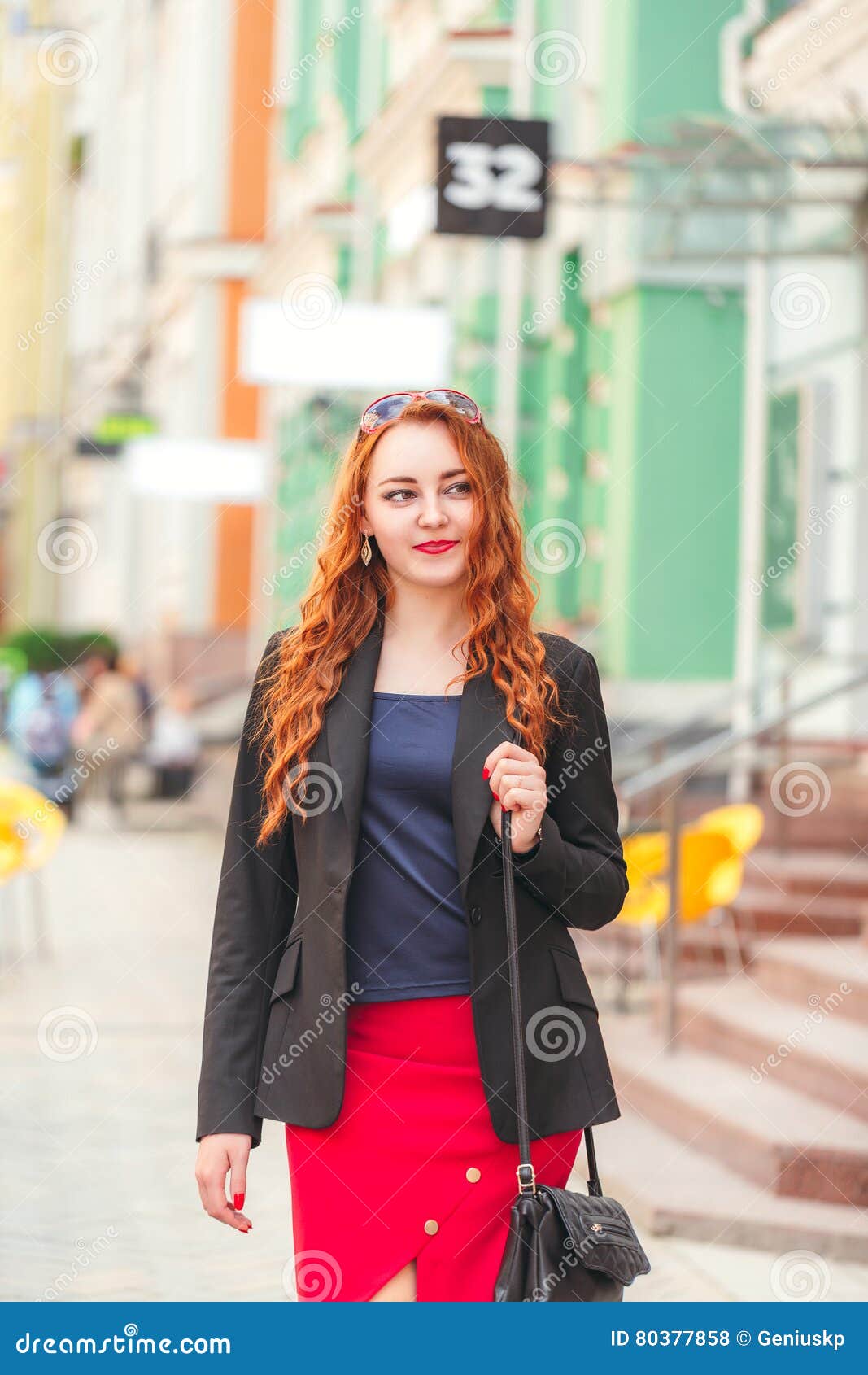 Young Red-haired Business Woman Walking Down the Street Stock Photo ...