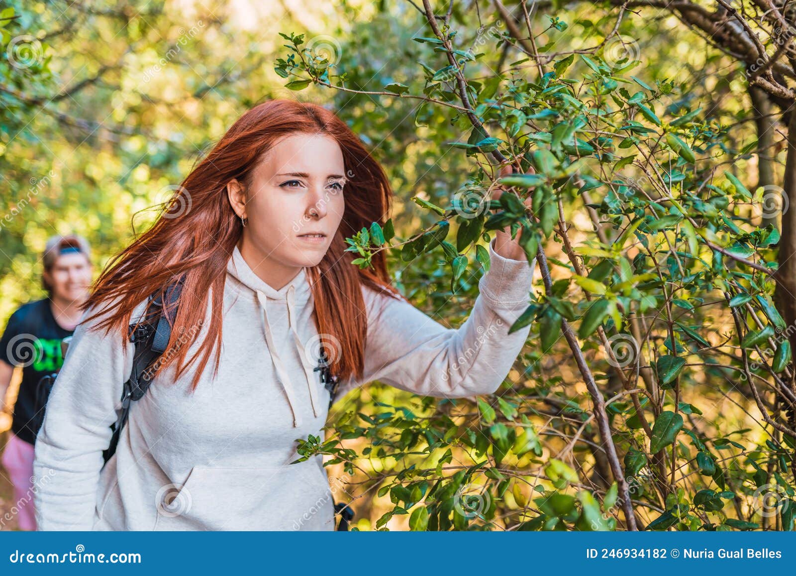 Young Red-haired Woman Walking in Nature, Contemplating the Horizon ...