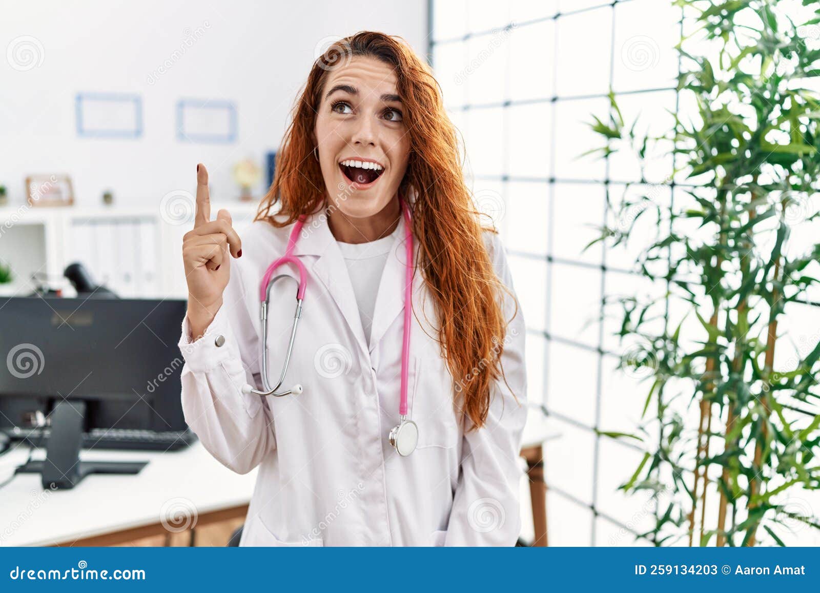 Young Redhead Woman Wearing Doctor Uniform And Stethoscope At The