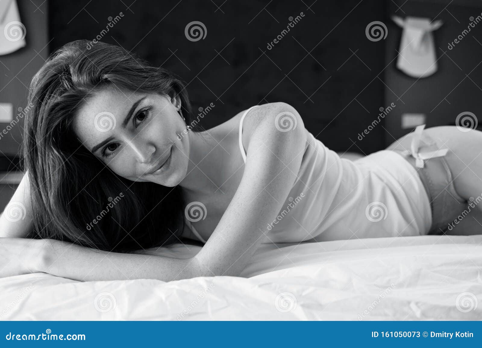 Young Redheaded Woman Half-naked Lying on the picture