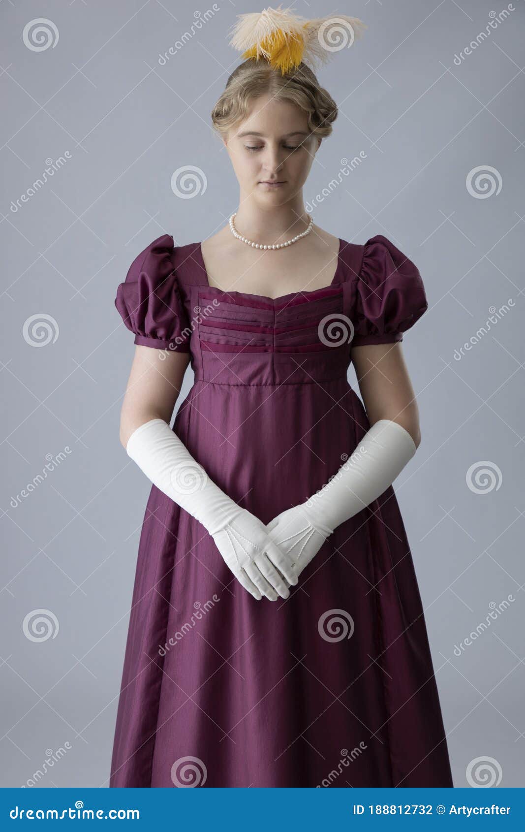 a young regency woman in a an evening dress