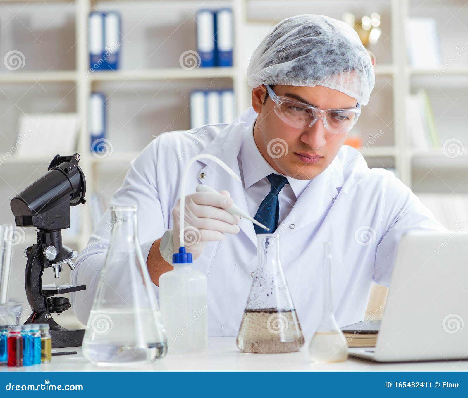 Young Researcher Scientist Doing a Water Test Contamination Expe Stock