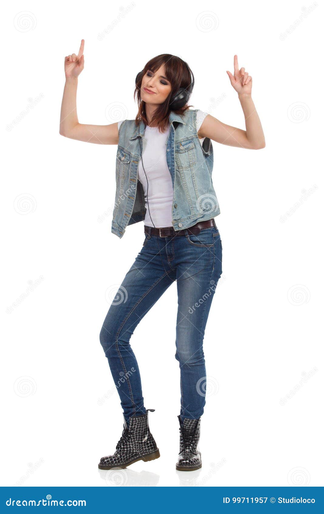 Young Rock Girl in Headphones is Dancing and Pointing Up Stock Image ...
