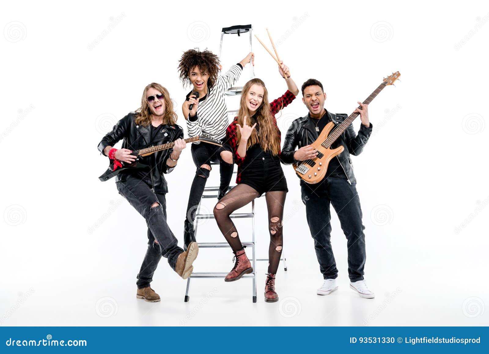 Young Rock and Roll Band Posing with Ladder Holding Microphone and