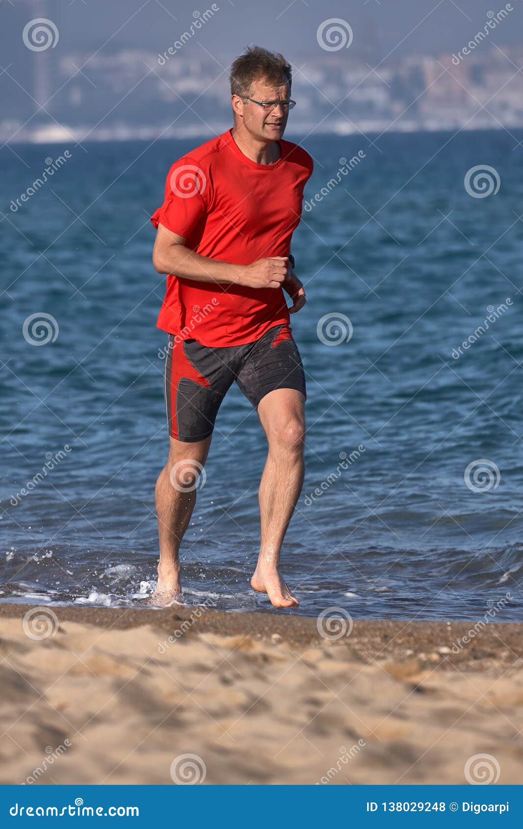 Young Runner Running in Red Tshirt at Springtime on the Spanish Beach