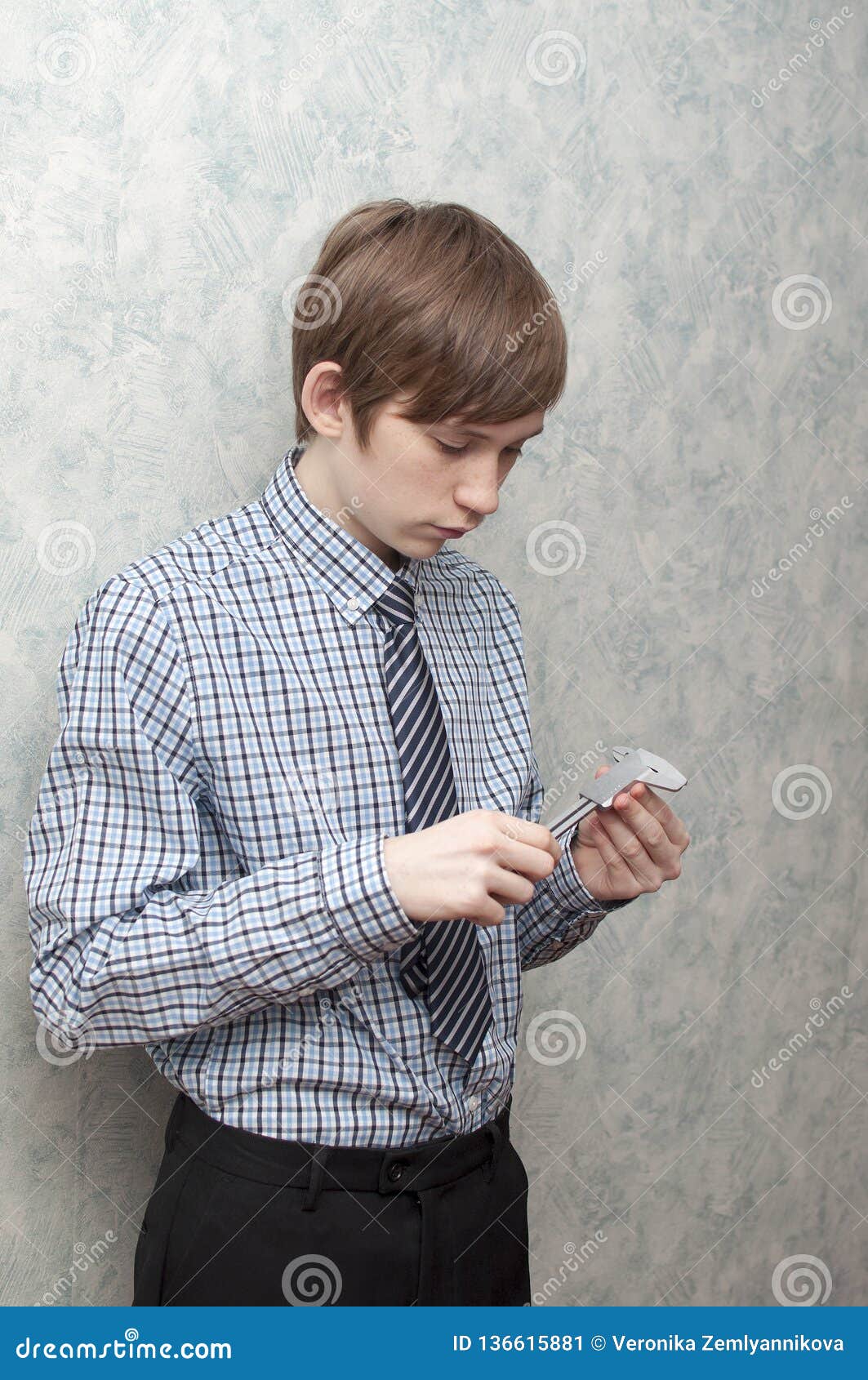 The Young Russian Guy Holds a Caliper in Hand Stock Image Image of